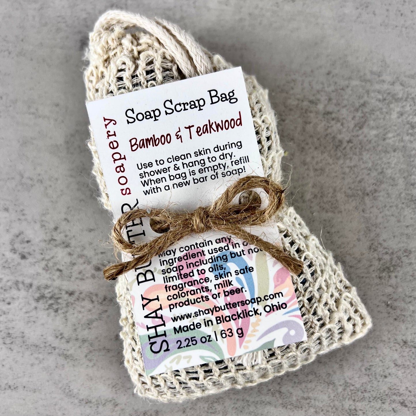 Bamboo and Teakwood Soap scrap bag on a gray background