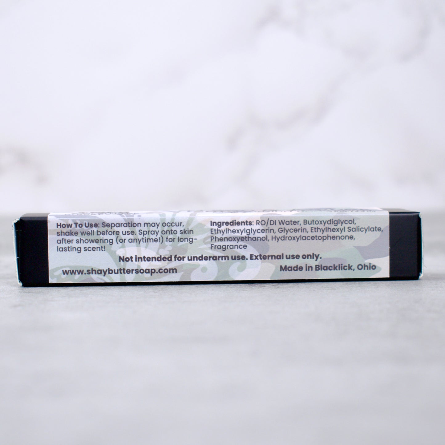 Body spray box with label on a white background