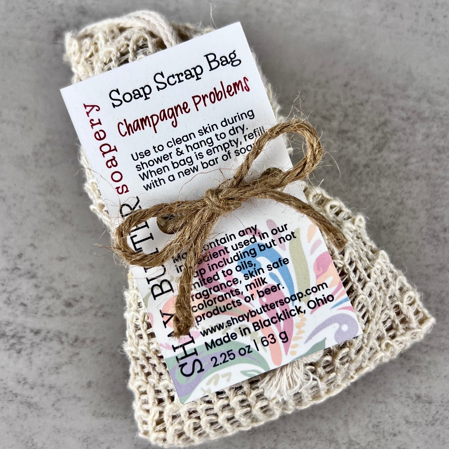 Champagne problems soap scrap bag with a label on a gray background