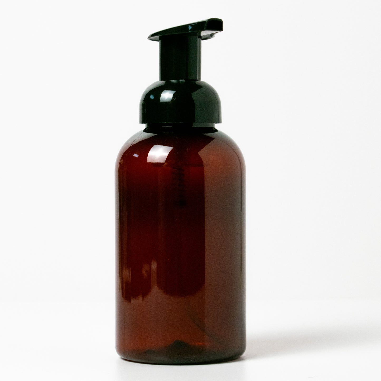 Brown bottle with black pump on a white background