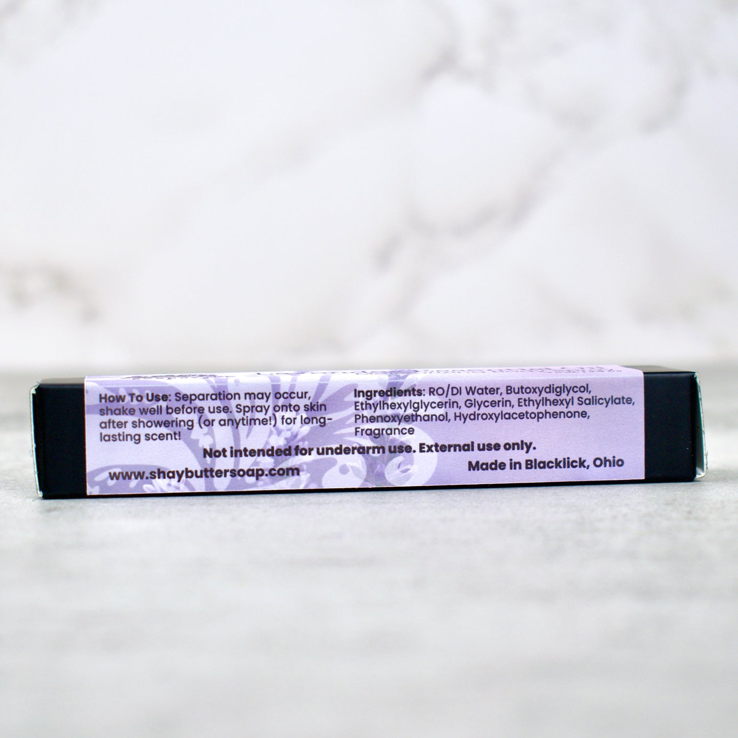 Body spray with a label on a white background