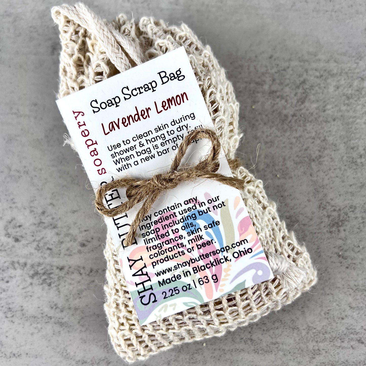 Soap scrap bag with lavender lemon scent on a gray background