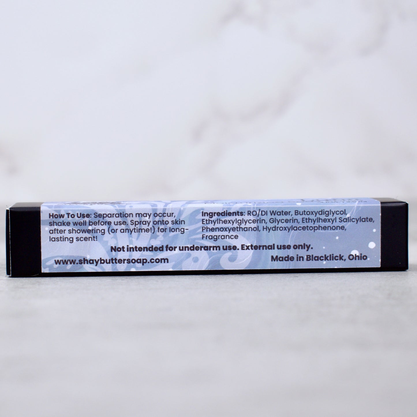 Body spray packaging with label on a white background