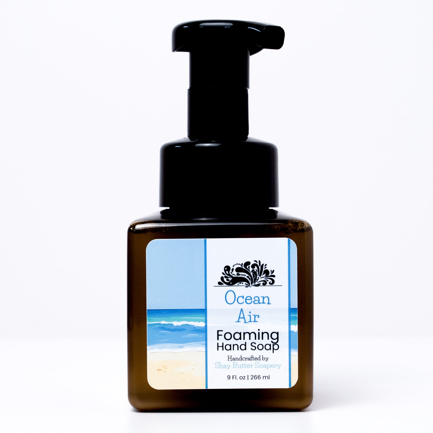 a bottle of "ocean air" foaming hand soap on a white background