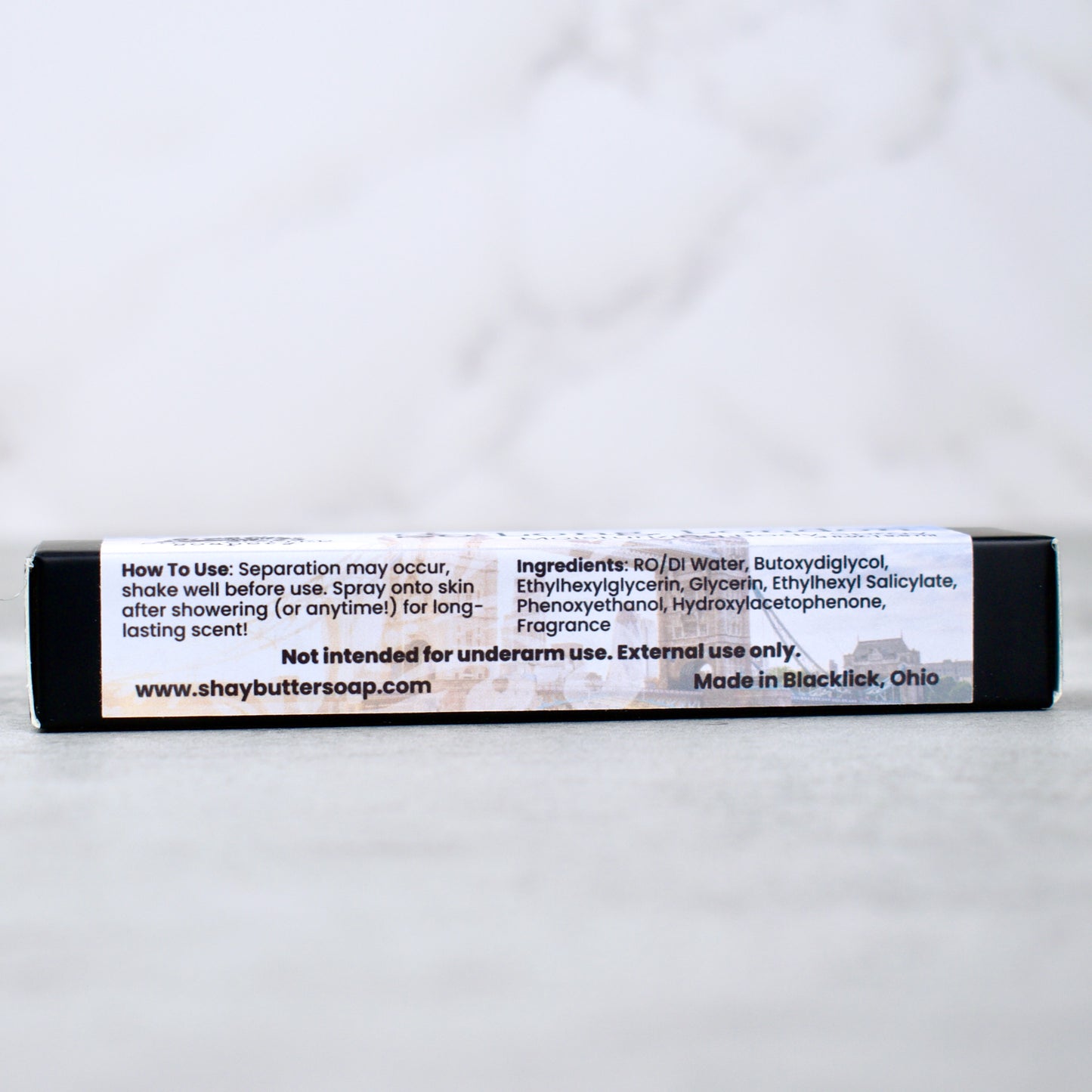 body spray packaging on neutral surface