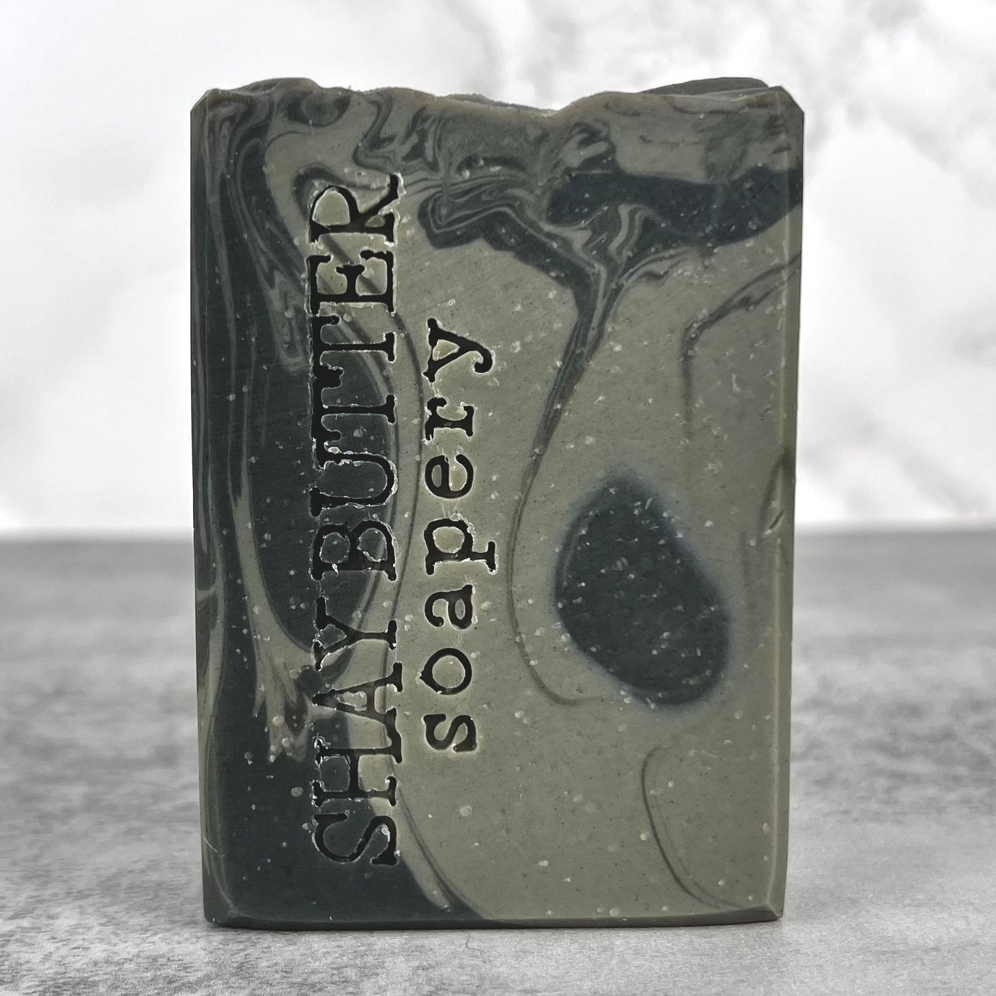 Bar of soap with 'Shay Butter' branding on a gray background