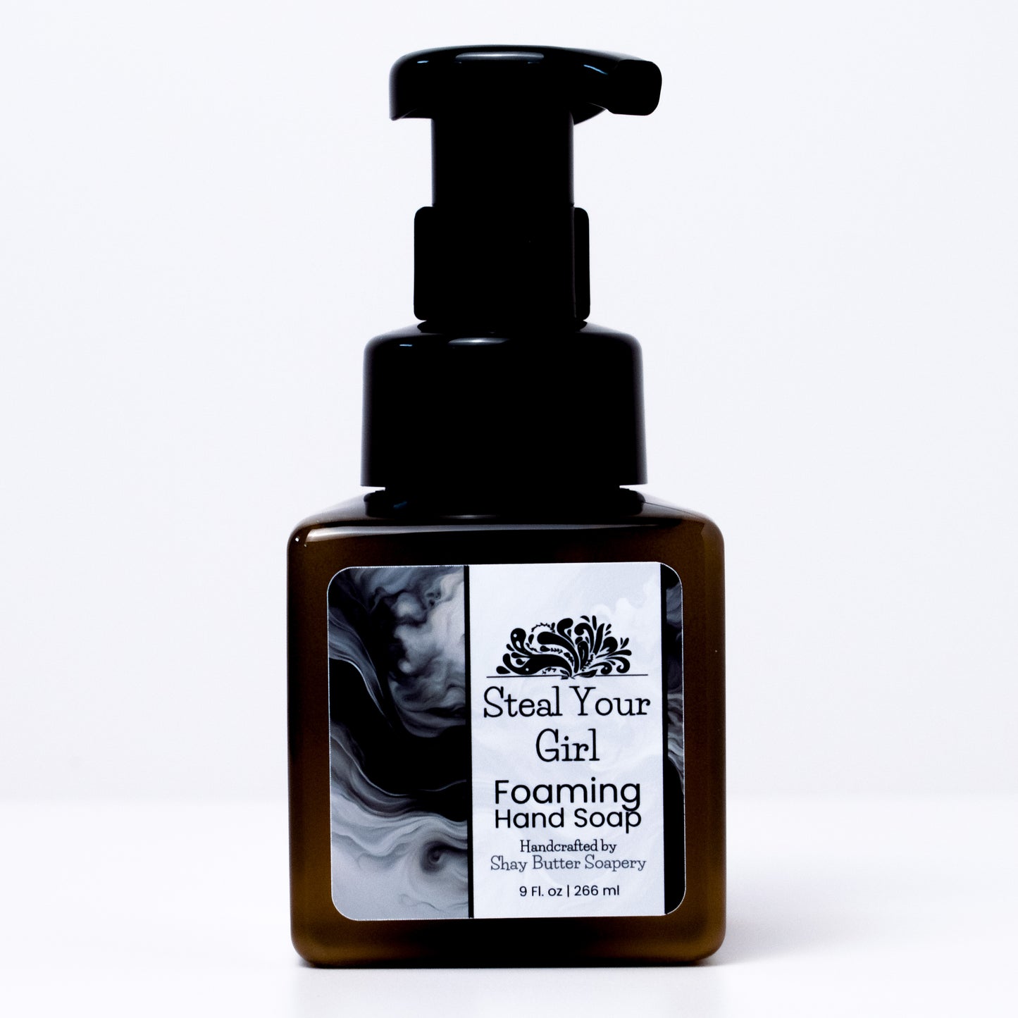 a bottle of "steal your girl" foaming hand soap on a white background
