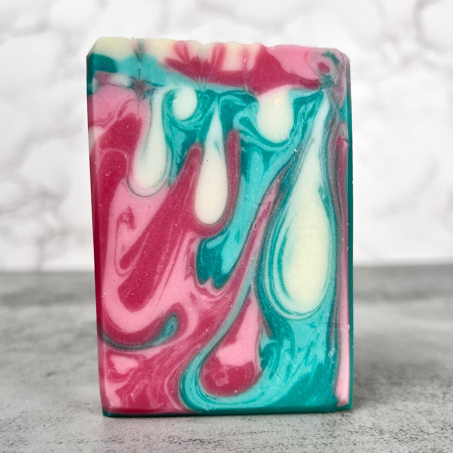 Colorful swirled soap bar on a neutral background