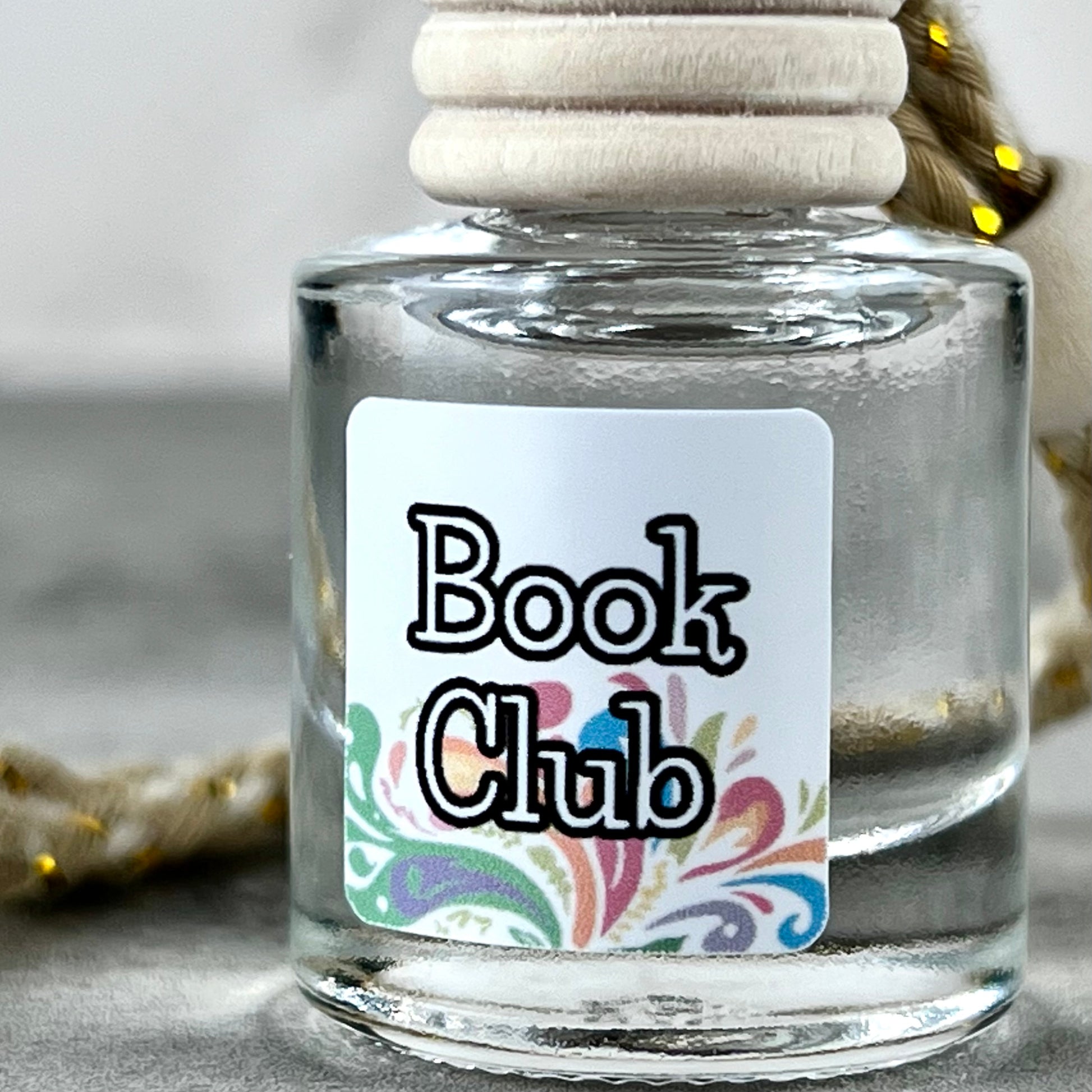 Car diffuser with a 'Book Club' label on a neutral background
