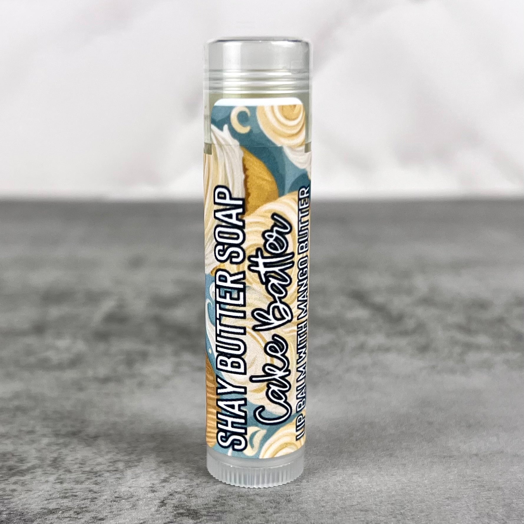 Lip balm on grey surface