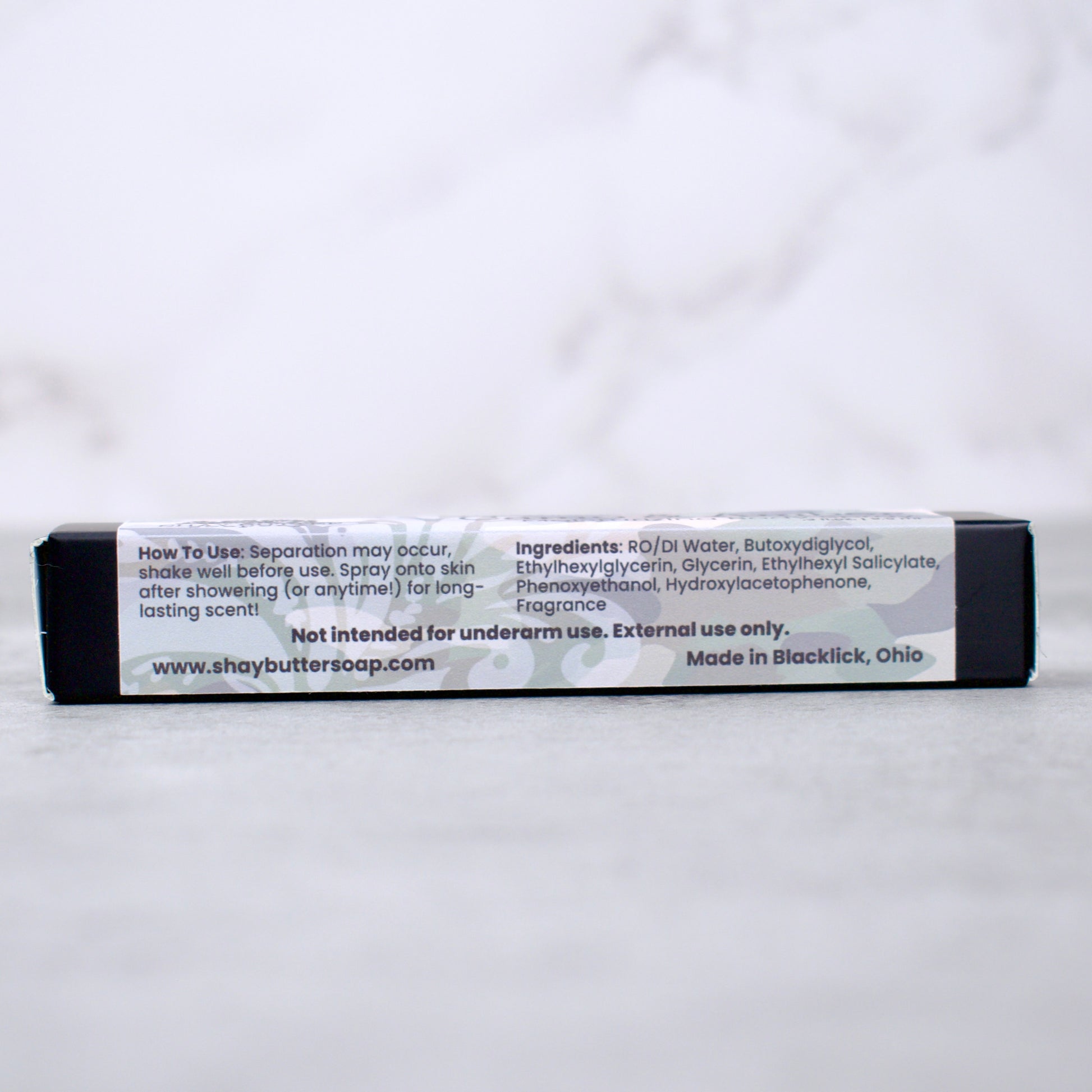 Body spray box with label on a white background
