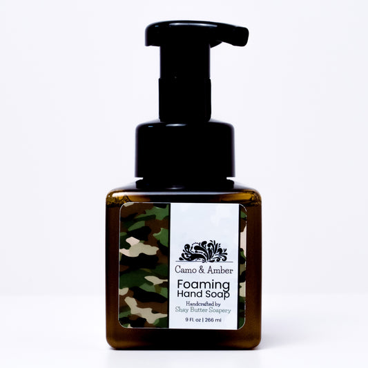 A bottle of "camo and amber" foaming hand soap on a white background