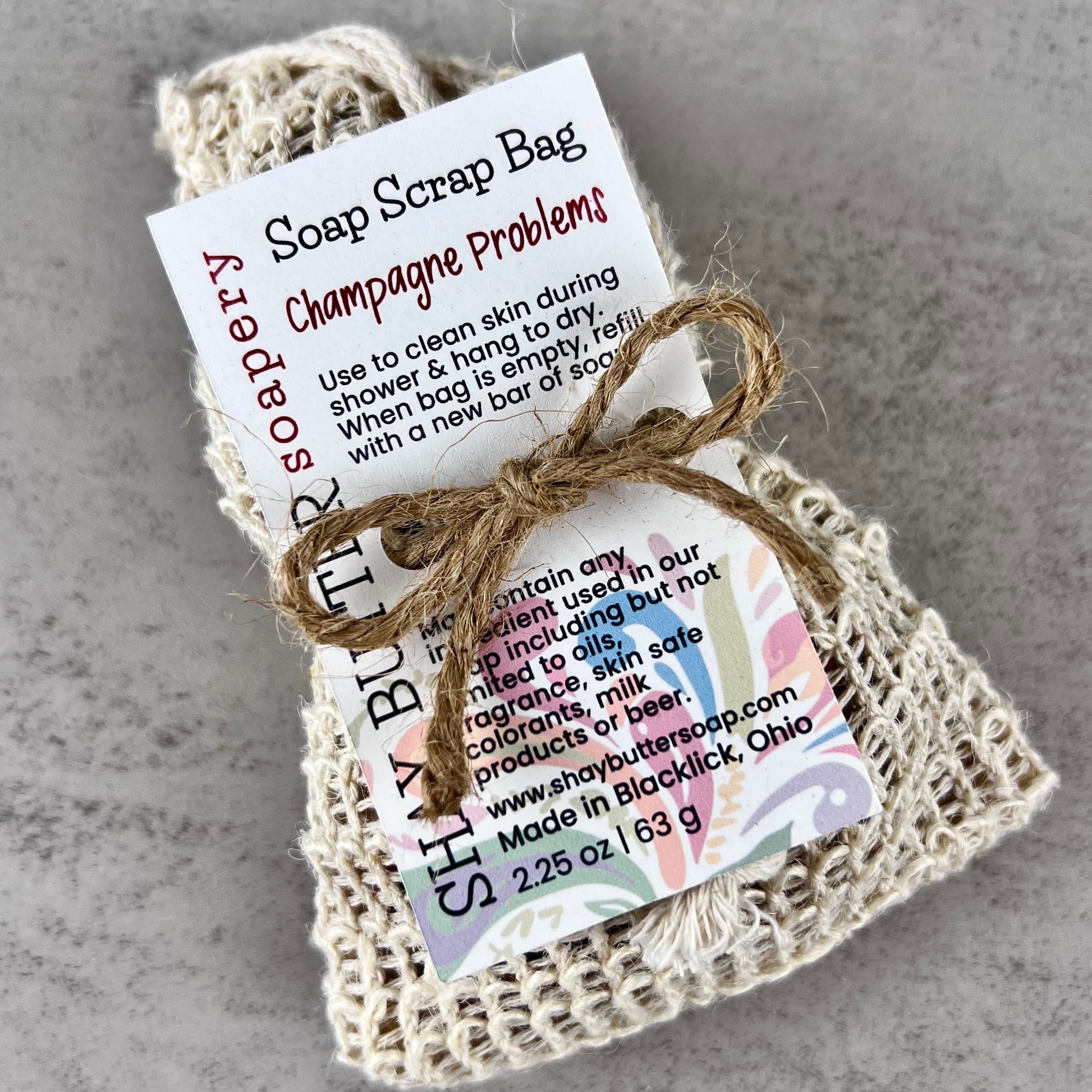 Champagne problems soap scrap bag with a label on a gray background