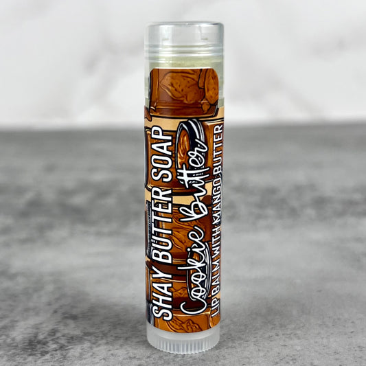 Lip balm with cookie butter flavor on a gray background