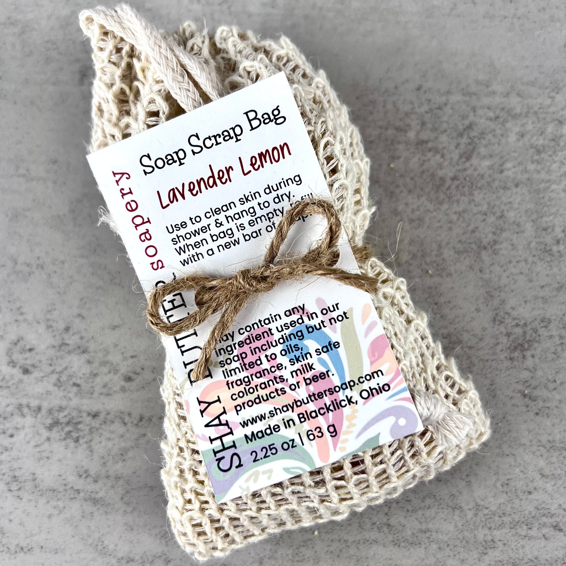 Soap scrap bag with lavender lemon scent on a gray background