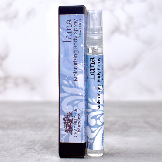 Luna moisturizing body spray with packaging on a light gray background