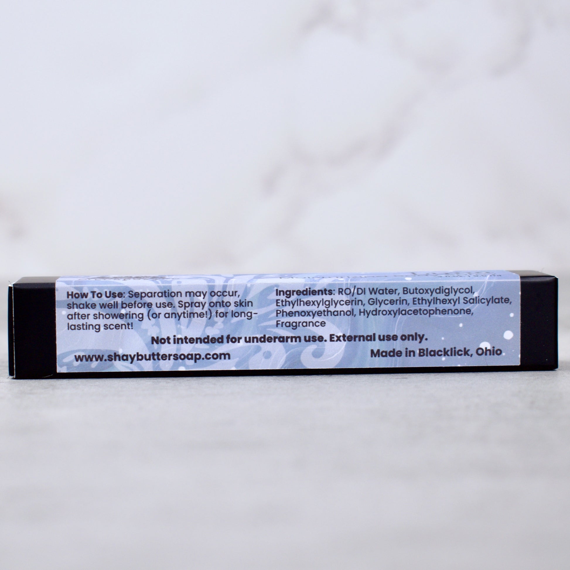 Body spray packaging with label on a white background