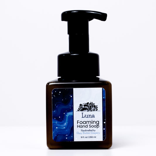 a bottle of "luna" foaming hand soap on a white background