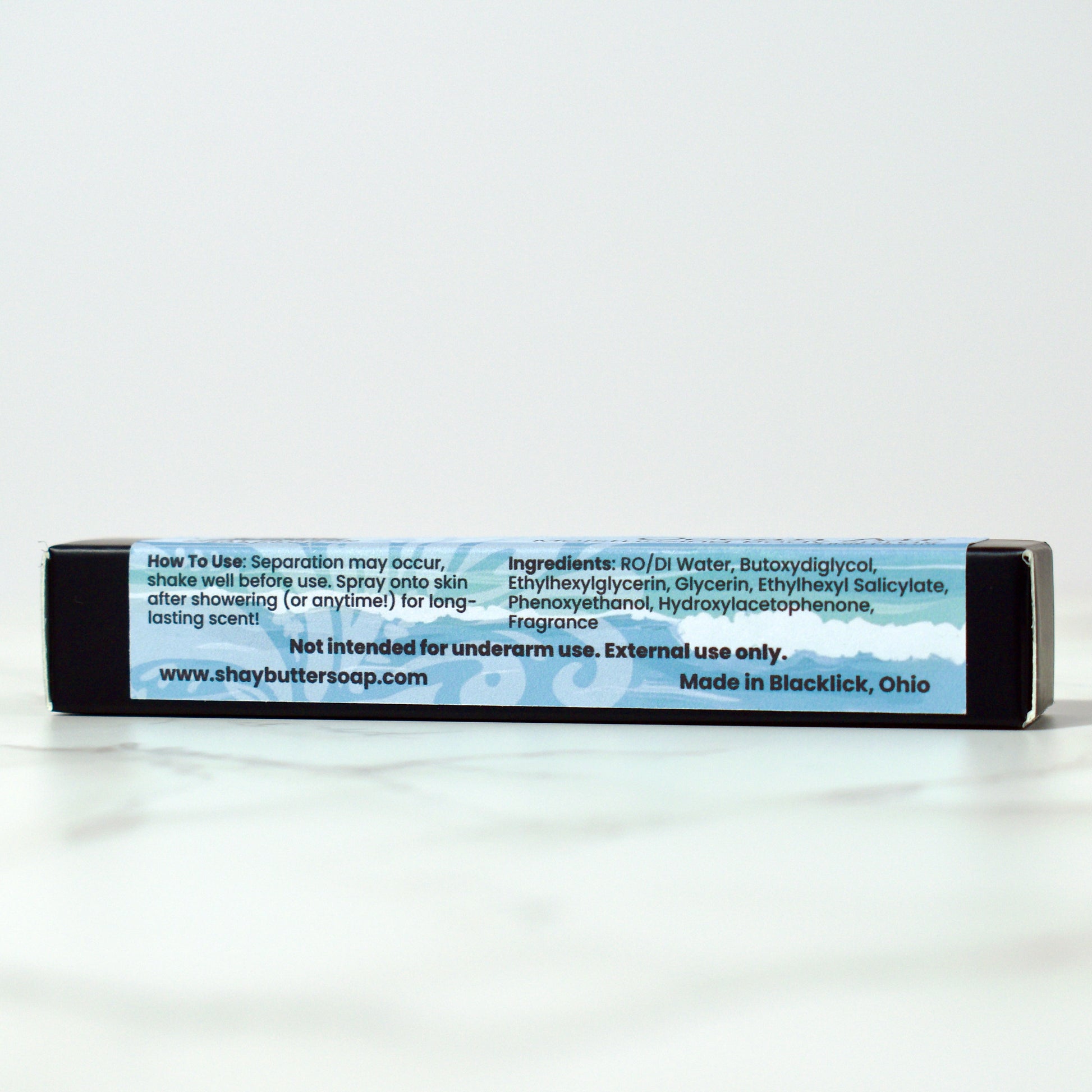 Body spray packaging with text on a white background