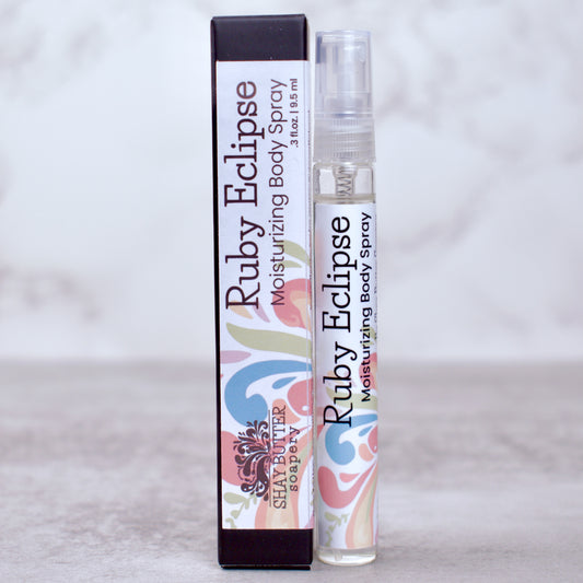 Ruby Eclipse moisturizing body spray with packaging on a light gray background