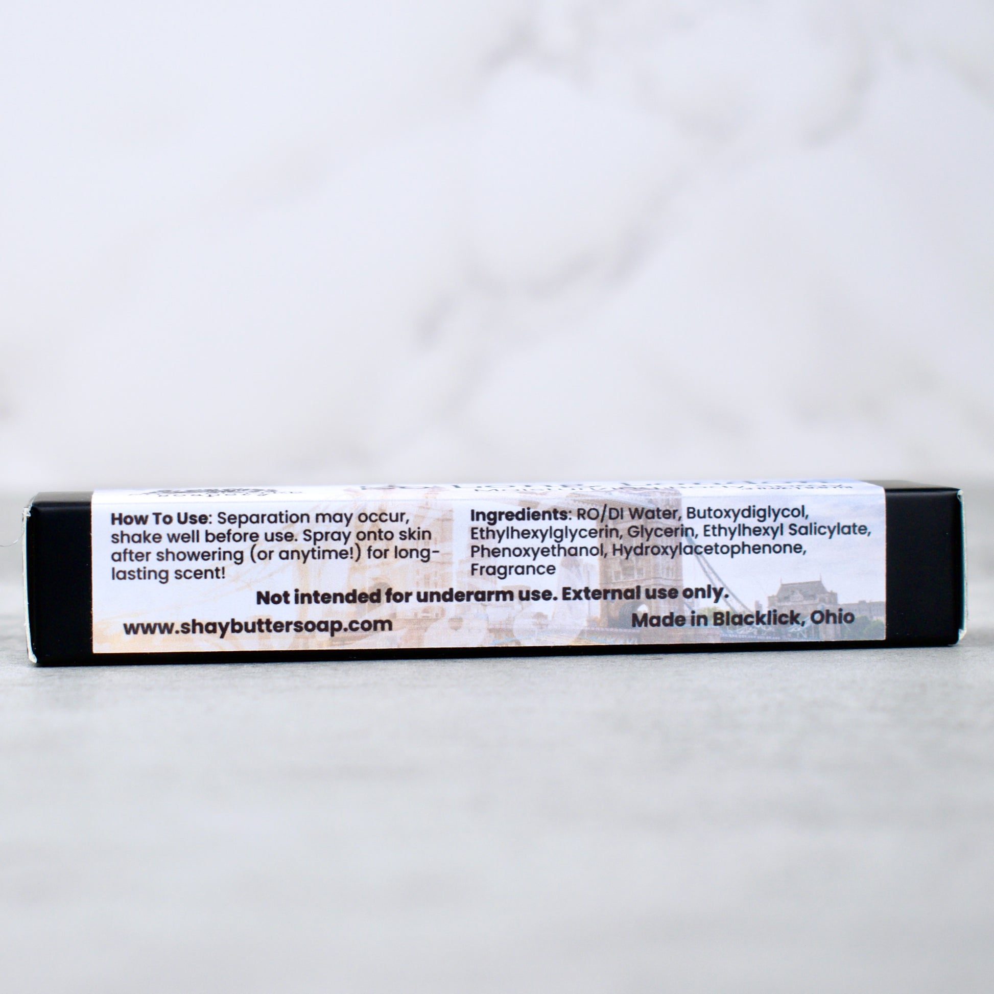 body spray packaging on neutral surface