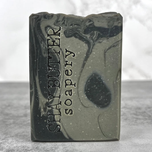 Bar of soap with 'Shay Butter' branding on a gray background