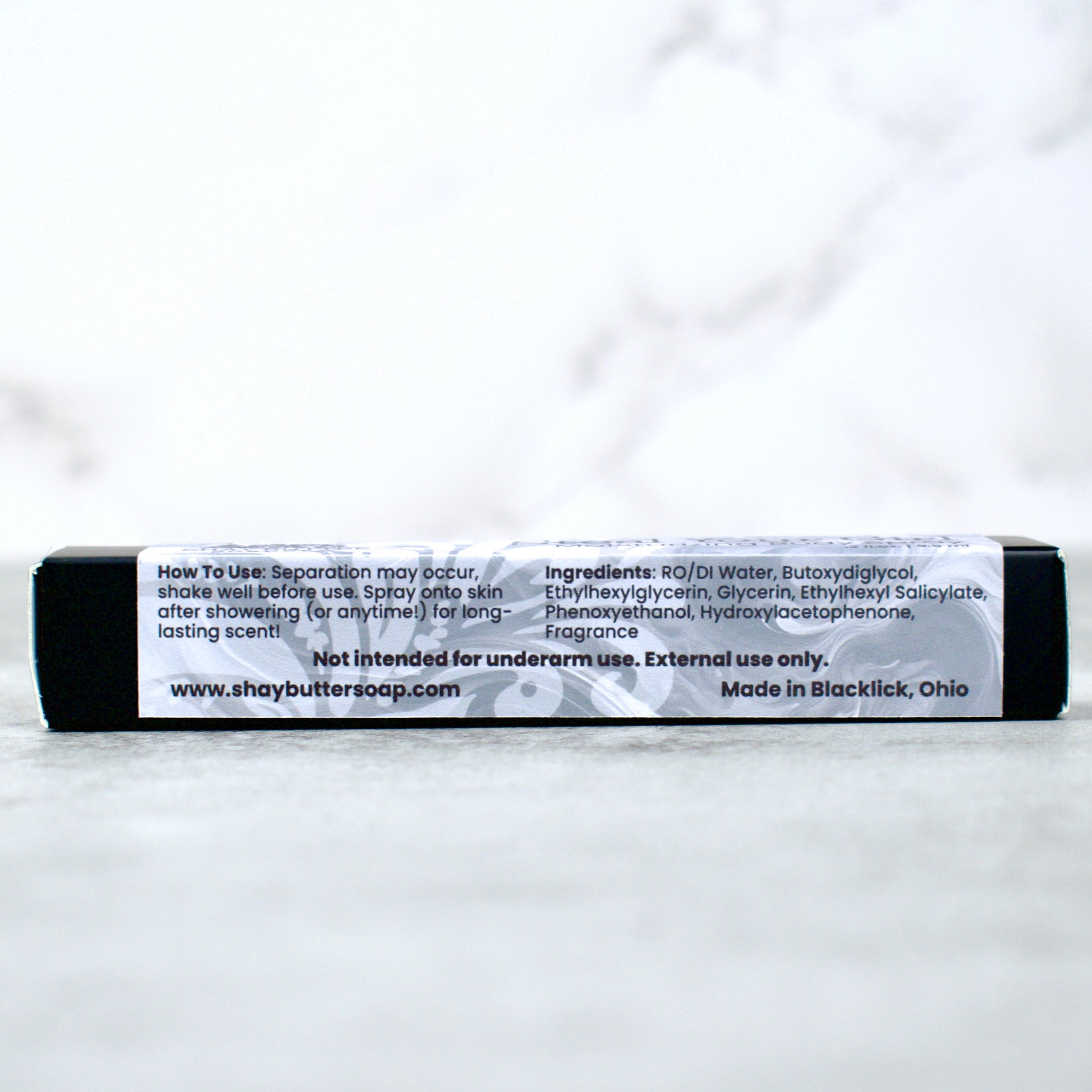 Body spray packaging with label on a white background