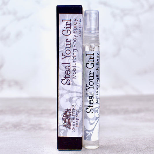 Steal Your Girl moisturizing body spray with packaging on a light background