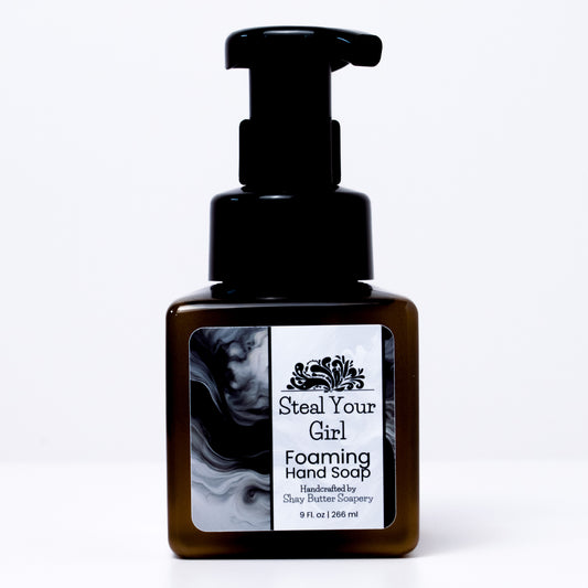 a bottle of "steal your girl" foaming hand soap on a white background