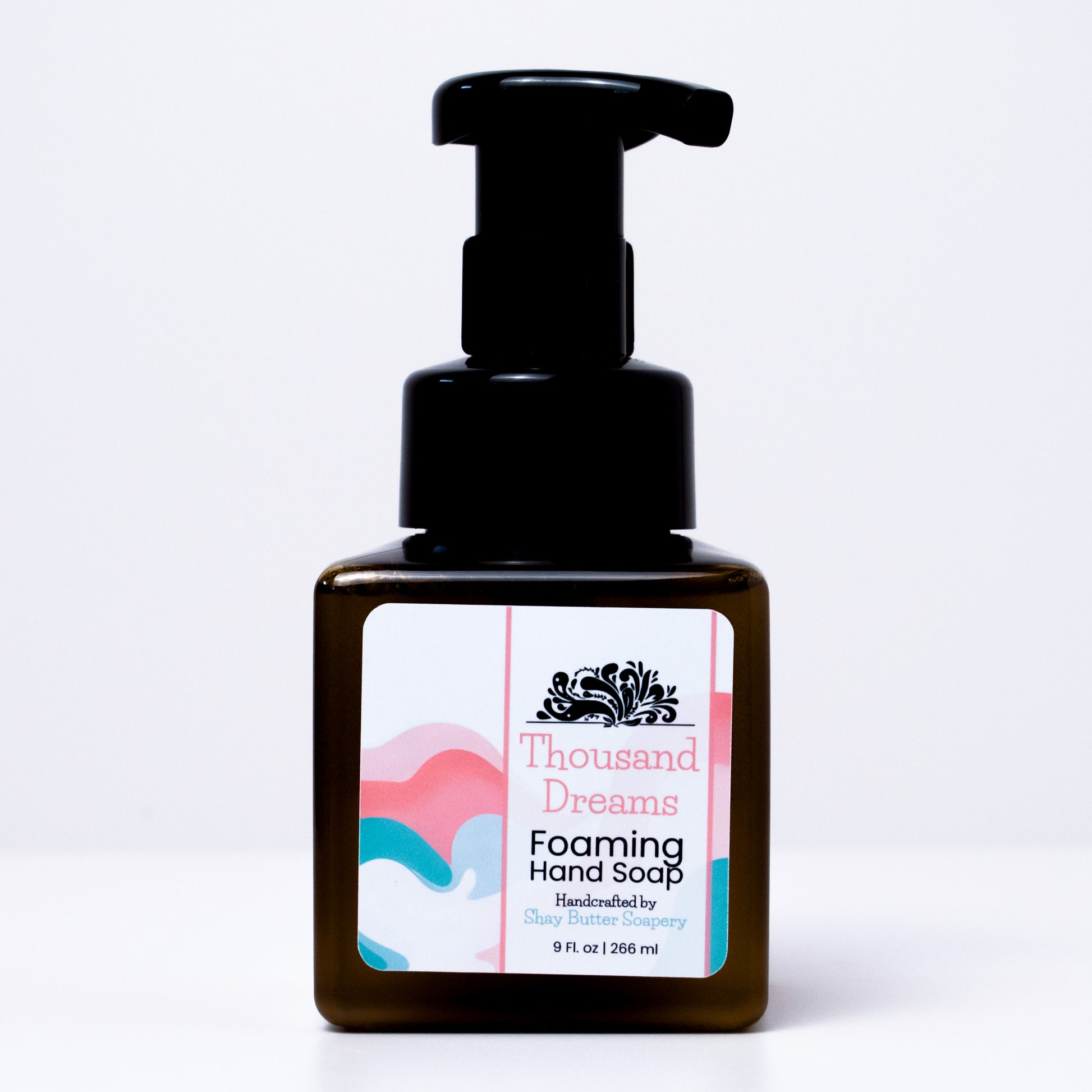 a bottle of "thousand dreams" foaming hand soap on a white background