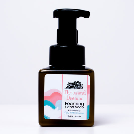 a bottle of "thousand dreams" foaming hand soap on a white background